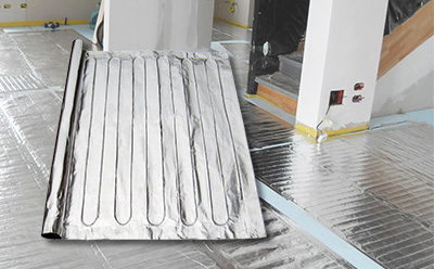 The FoilHeat floor heating system installed on basement floor.